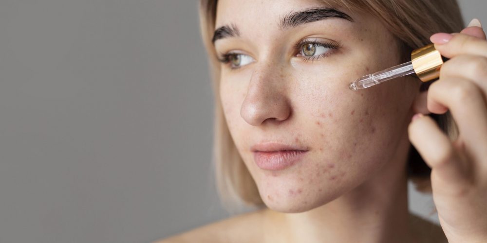 close-up-woman-using-serum